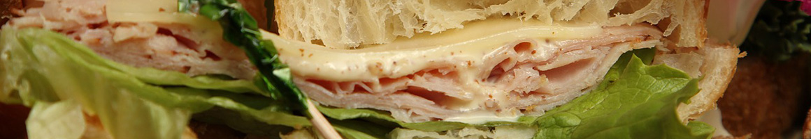 Eating Sandwich Cheesesteak at Denver Ted's Cheesesteaks restaurant in Denver, CO.